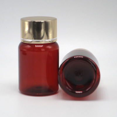 40 ml/1.3 oz de píldora de PET ámbar cápsula botella de aceite de pescado con tapa de tornillo de aluminio plateado