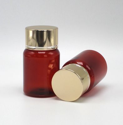 40 ml/1.3 oz de píldora de PET ámbar cápsula botella de aceite de pescado con tapa de tornillo de aluminio plateado